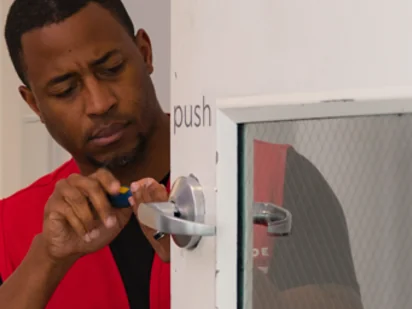 handyman fixing an office building door